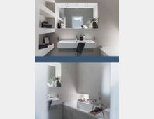 Modernes Badezimmer mit einer rechteckigen, weißen Waschbecken- und Spiegelkombination sowie einer Badewanne. Die Wände sind in hellem Beige gestaltet, mit offenen Regalen an einer Seite und einer dezenten Dekoration wie Handtüchern, Pflanzen und Seifenspendern.