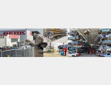 Ein Gelände einer Autoverwertungsfirma mit mehreren Bereichen: Links ein Gebäude mit Aufschrift „Berk Autoverwertung“, davor parkende Autos und ein Zaun. Rechts mehrstöckige Regalreihen mit gebrauchten Autoteilen und gestapelten Fahrzeugkarosserien unter einem überdachten Bereich. Im Inneren eine Werkstatt mit Maschinen und einem Mitarbeiter in roter Arbeitskleidung.