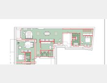 Grundriss einer Wohnung mit mehreren Räumen, einschließlich eines Wohnbereichs, Essbereichs, Schlafzimmers, Badezimmers und Küche. Die Räume sind mit Möbeln, Türen und Wänden detailliert dargestellt, und rote Linien markieren die Raumgrenzen.