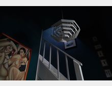 Ein Innenraum mit dunkel gestrichenen Wänden, einer weißen Holztreppe und einer modernen, geometrischen Hängelampe. An der Wand hängen ein gerahmtes Gemälde mit abstrakten Figuren und mehrere kleinere Bilder oder Zeichnungen.
